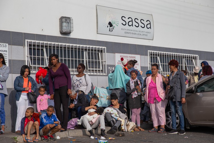 Photo of people outside a SASSA office