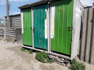 Photo of toilet with green door