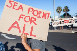 photo of protest with banner