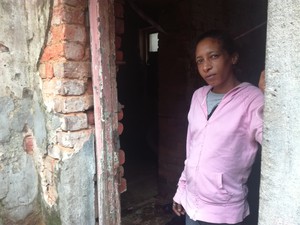 Photo of woman in broken doorway