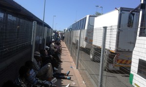 Photo of people sitting in a line