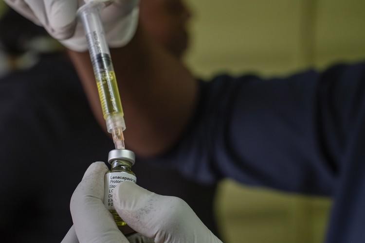 A nurse uses a syringe to draw Lenacapavir, an antiretroviral HIV prevention drug from a vial during a roll out of the drug as part of an implementation study by a Wits University research unit.