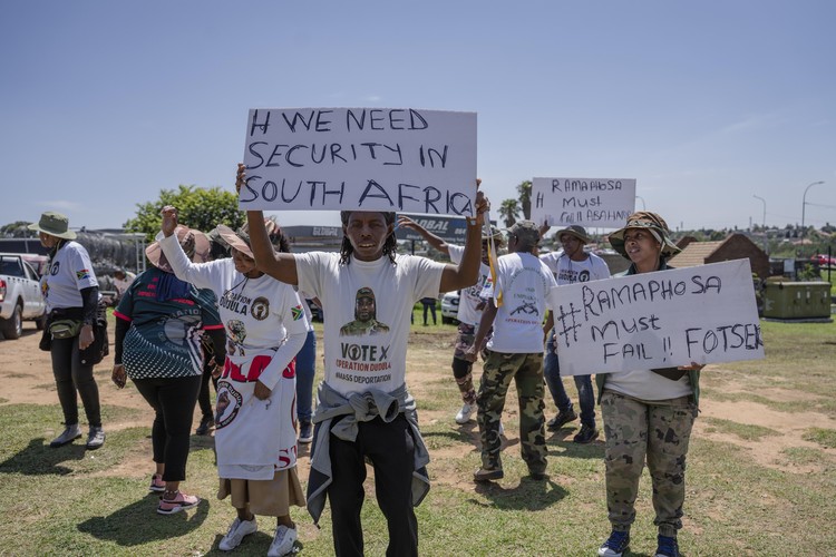Members of the anti-immigration vigilante group known as Operation Dudula during a protest staged by the group during the G20 leaders summit near Nasrec in Johannesburg, South Africa.