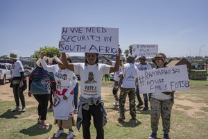 Members of the anti-immigration vigilante group known as Operation Dudula during a protest staged by the group during the G20 leaders summit near Nasrec in Johannesburg, South Africa.
