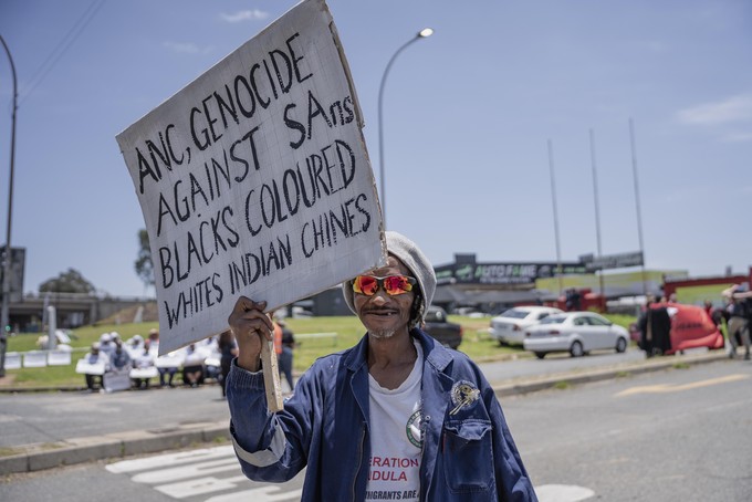 Members of the anti-immigration vigilante group known as Operation Dudula during a protest staged by the group during the G20 leaders summit near Nasrec in Johannesburg, South Africa.
