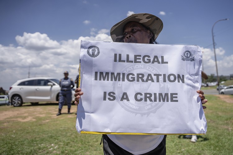 Members of the anti-immigration vigilante group known as Operation Dudula during a protest staged by the group during the G20 leaders summit near Nasrec in Johannesburg, South Africa.