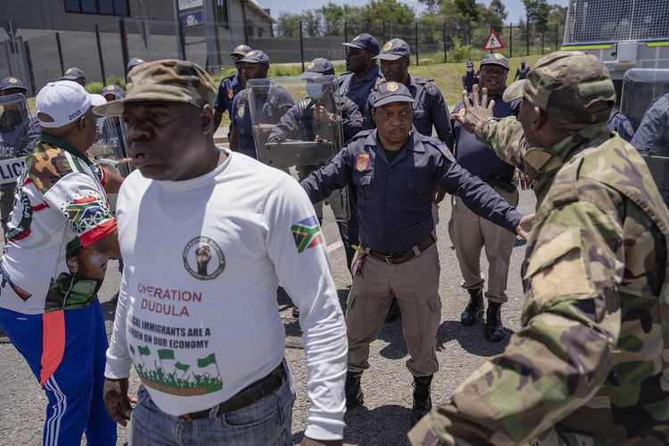 Members of the anti-immigration vigilante group known as Operation Dudula are confronted by police during a protest staged by the group during the G20 leaders summit near Nasrec in Johannesburg, South Africa.