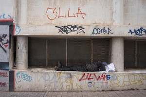 A homeless man is seen sleeping on the streets of the Johannesburg CBD.