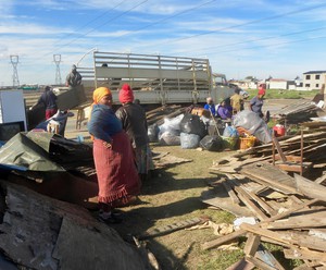 Photo of people packing uo their shacks