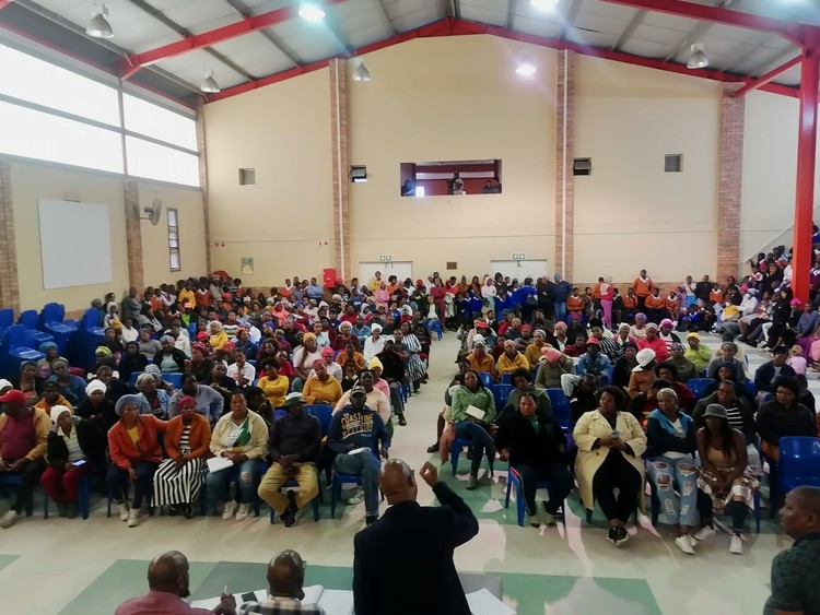 Photo of a community meeting in a hall