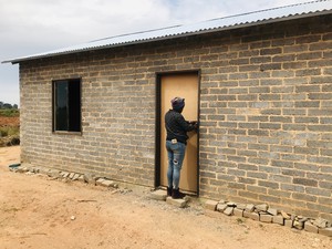 Photo of Maria Madi at the house she occupied