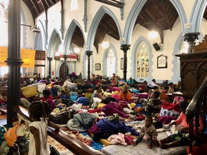 Photo of people living in church