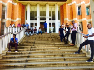 Photo of people sitting on stairs