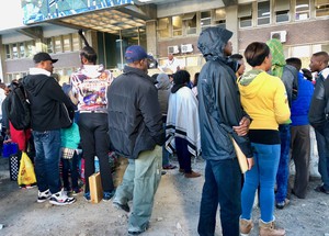 Photo of people in a queue