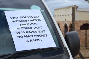 Photo of taxi with placard in the windscreen