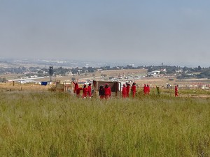 Photo of men in red