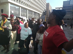 Photo of people outside a court