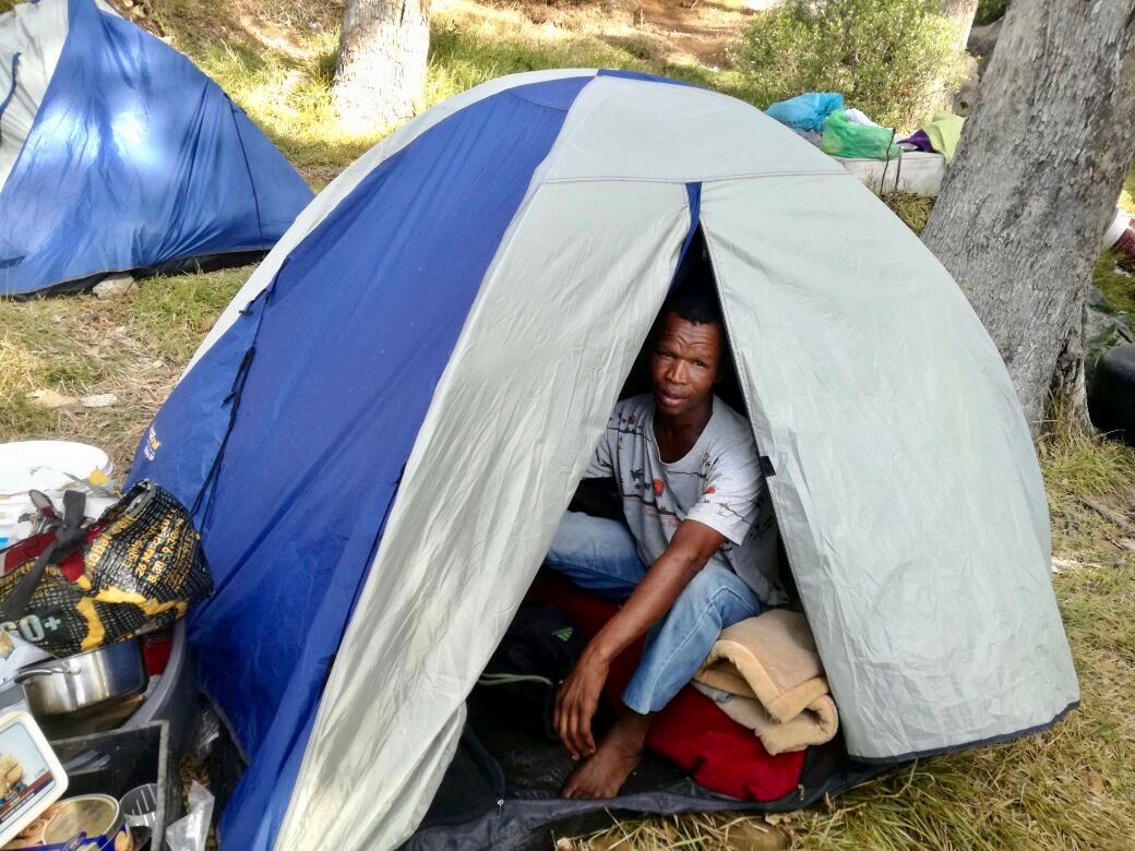Photo of a man in a tent